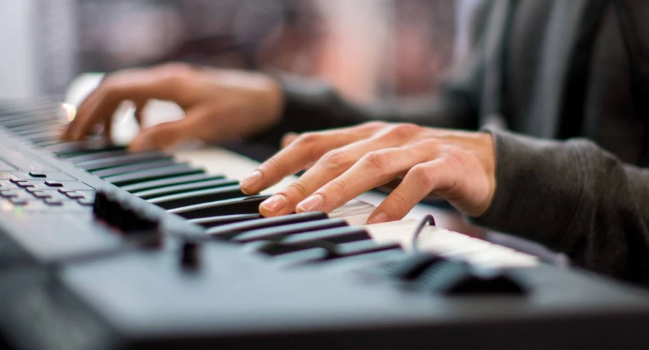 Musician playing an electronic keyboard