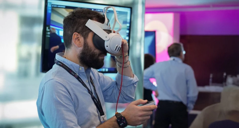 Attendee testing virtual reality headset at tech event