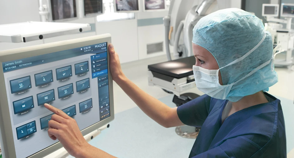 Medical professional using touchscreen interface in operating room